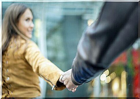 Couple holding hands