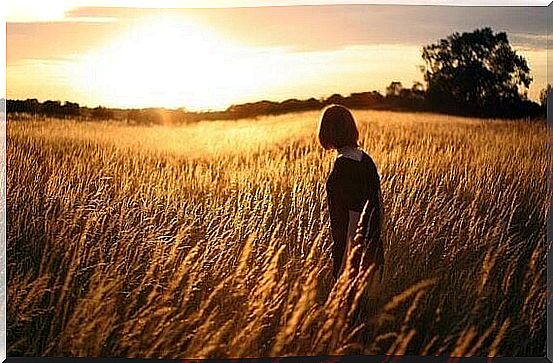 Woman walking on field.