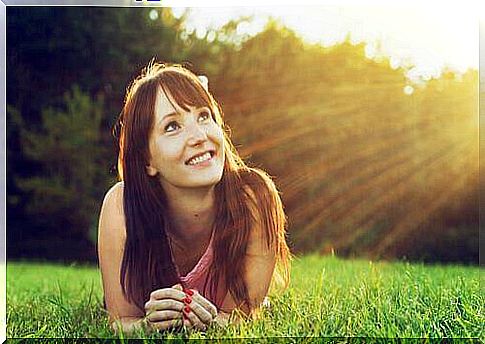 Woman lying in the grass.