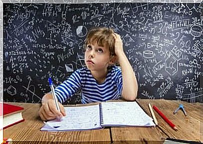 Schoolboy pondering math problem