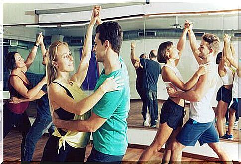 People dancing in a group.