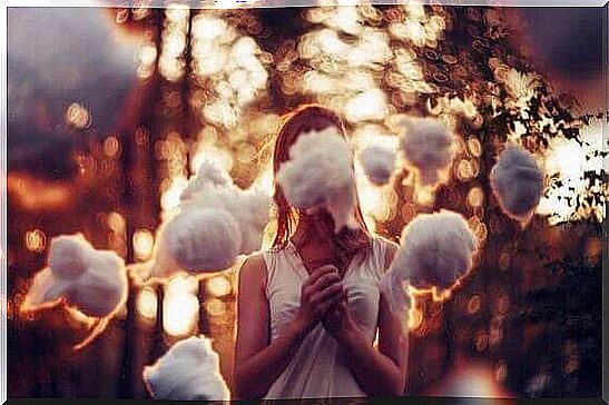 Woman surrounded by clouds.