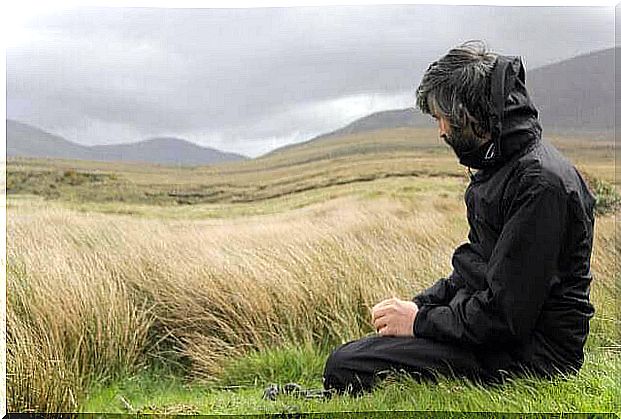 Man sitting by field.