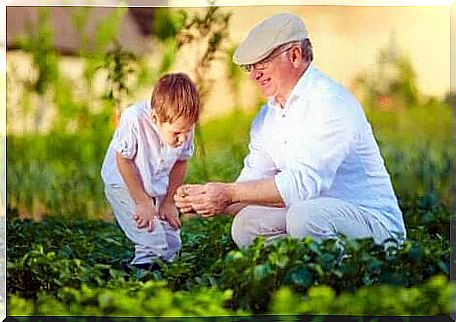 A boy and his grandfather are enjoying time together outdoors