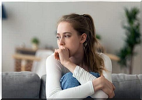 Woman sitting on the couch.